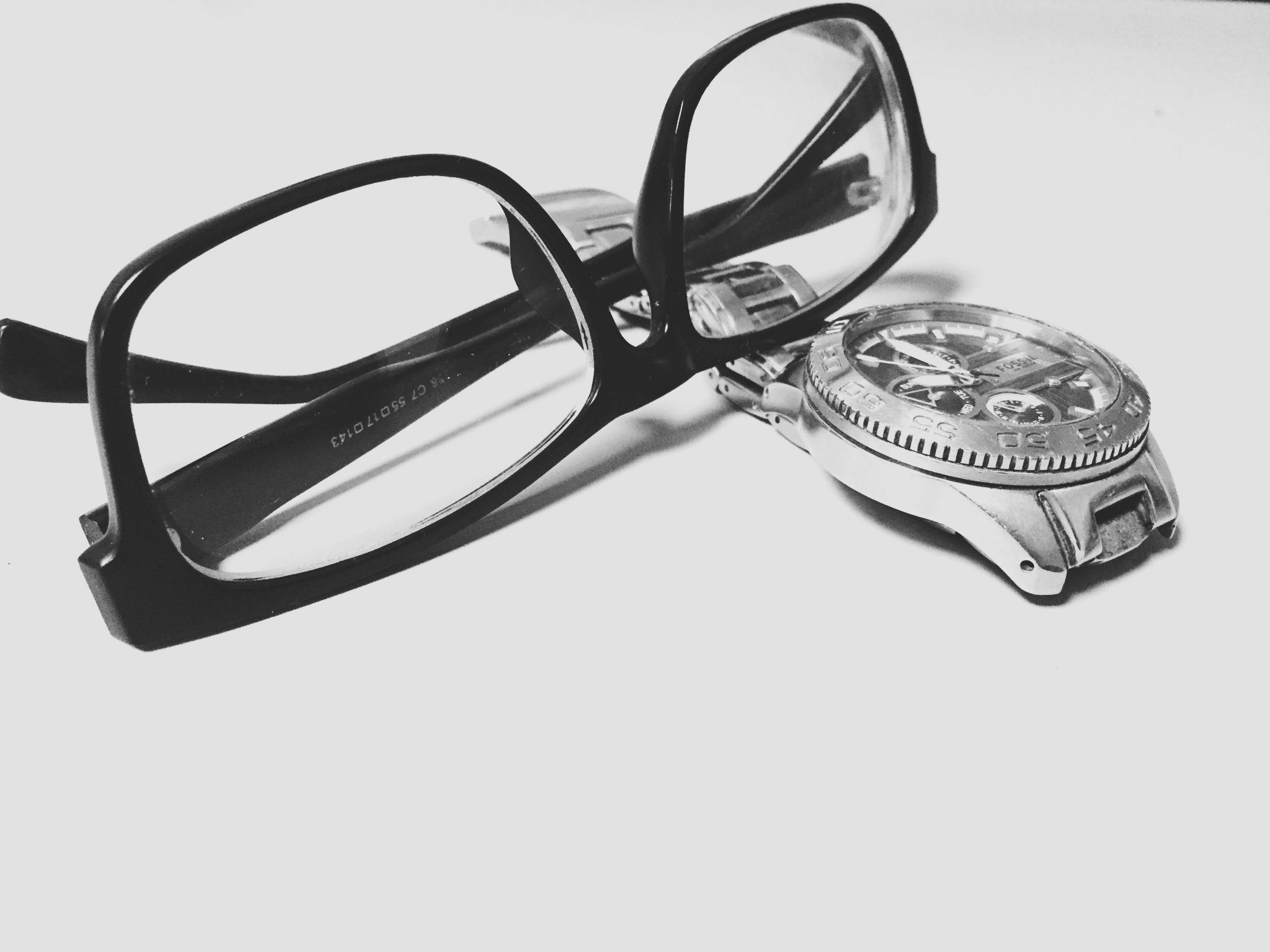 Classic reading glasses and watch